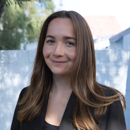 Picture of Kim Bente smiling at the camera in the Sydney sun.